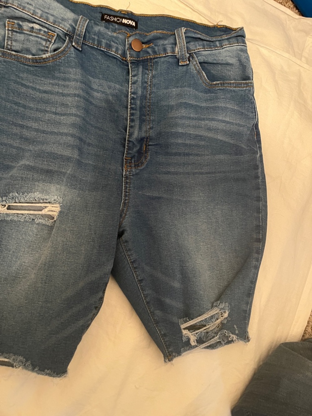 Fashion Nova Women’s Light Blue Distressed Denim Shorts
Size 13